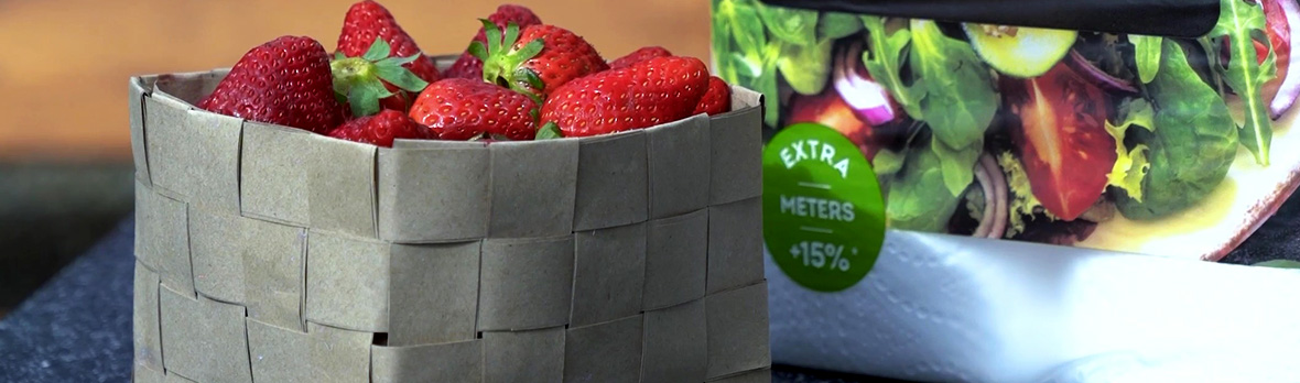 handmade grey paper bag basket filled with fresh strawberries